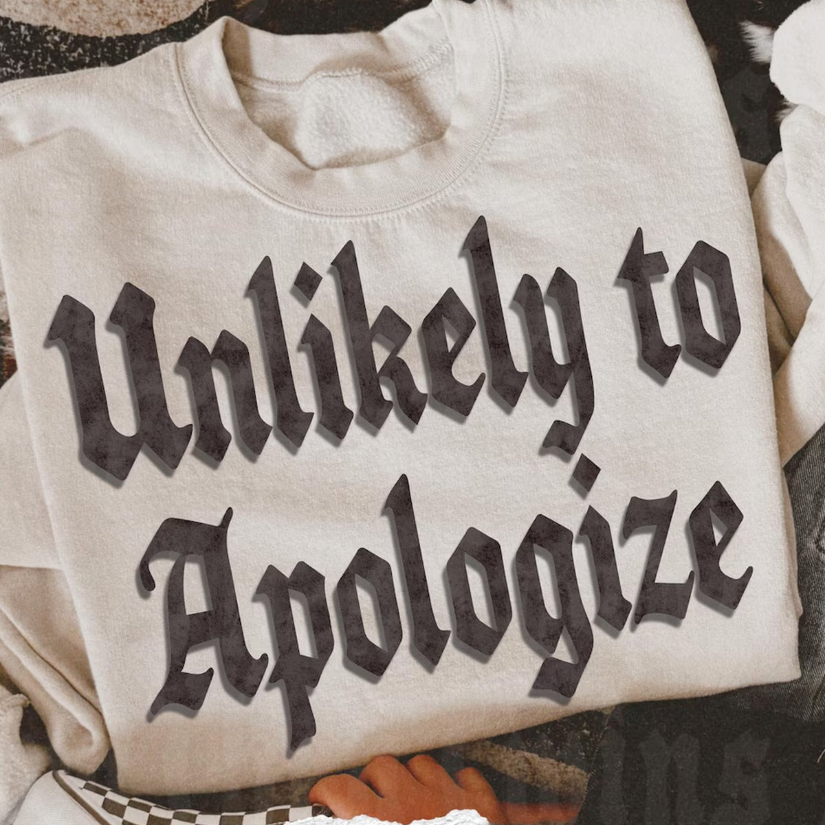 Unlikely to Apologize Graphic Tee
