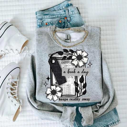 A Book a Day Keeps Reality Away Graphic Tee