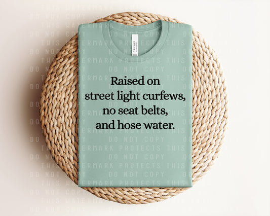 Raised on Street Light Curfews, No Seat Belts, and Hose Water Graphic Tee